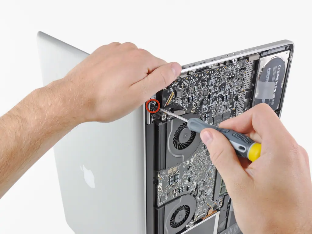 Technician repairing an opened MacBook Pro logic board at American Tech Berkeley